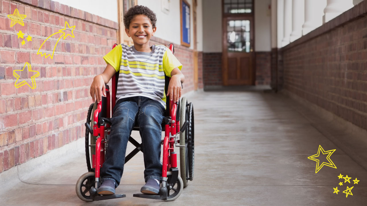 Smiling boy in wheelchair.